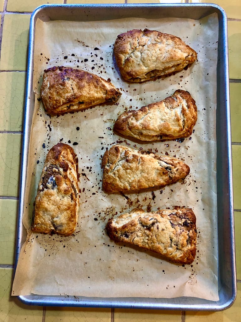 golden brown figs and walnut scones on a baking tray to illustrate the main point of this blog post.