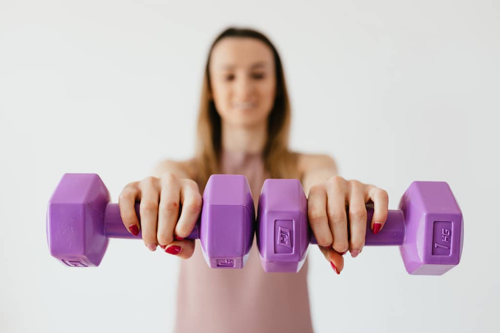 woman with a pair of weights