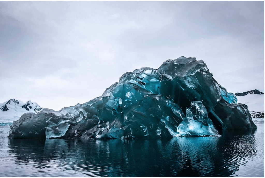 an iceberg flipped over showing its underside